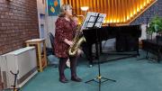 Maureen playing her saxaphone